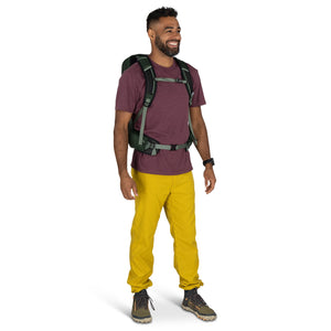 Hiker wearing the Osprey Talon 22 ventilated daypack on the trail