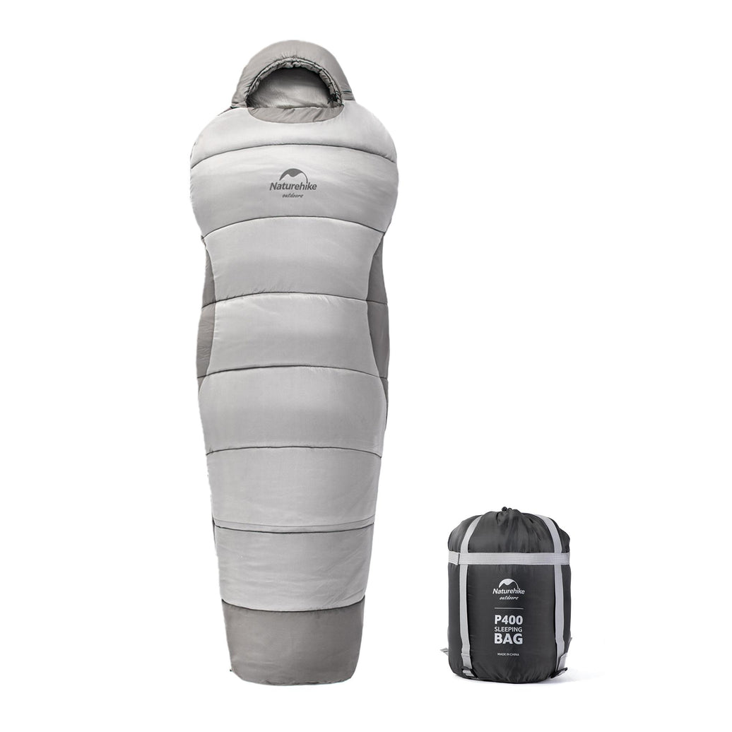 A gray Naturehike mummy cotton sleeping bag displayed next to its carrying bag.