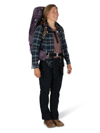 Woman wearing the Osprey Aura AG 50 backpack in Enchantment Purple on the trail