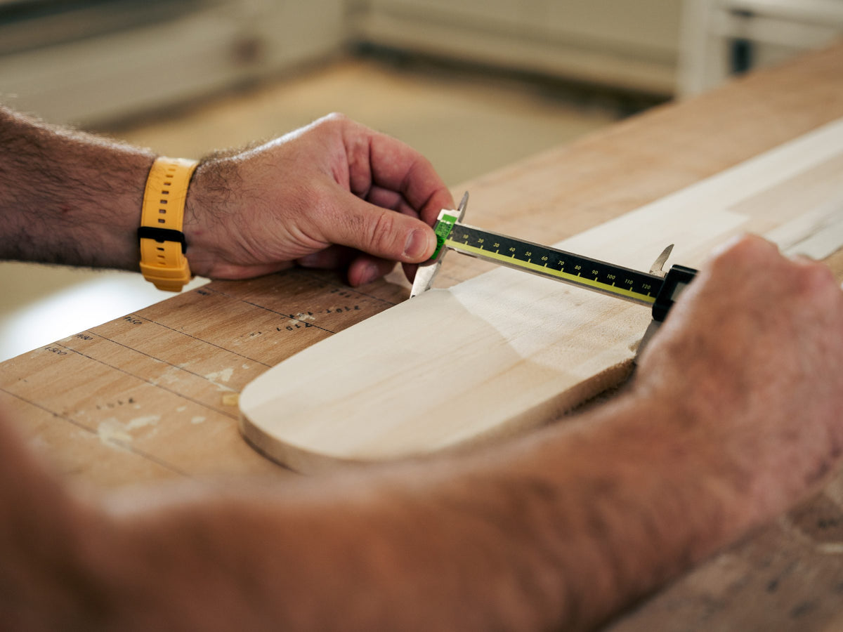 Measuring a wood core at the Elan factory