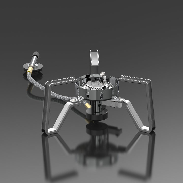 A silver portable gas stove with foldable stand and advanced wind-resistant technology, isolated on a grey background.