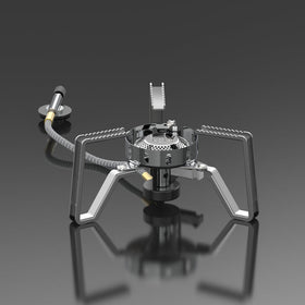 A silver portable gas stove with foldable stand and advanced wind-resistant technology, isolated on a grey background.