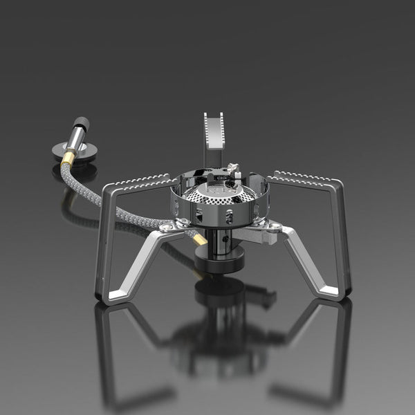 A silver portable gas stove with foldable stand and advanced wind-resistant technology, isolated on a grey background.