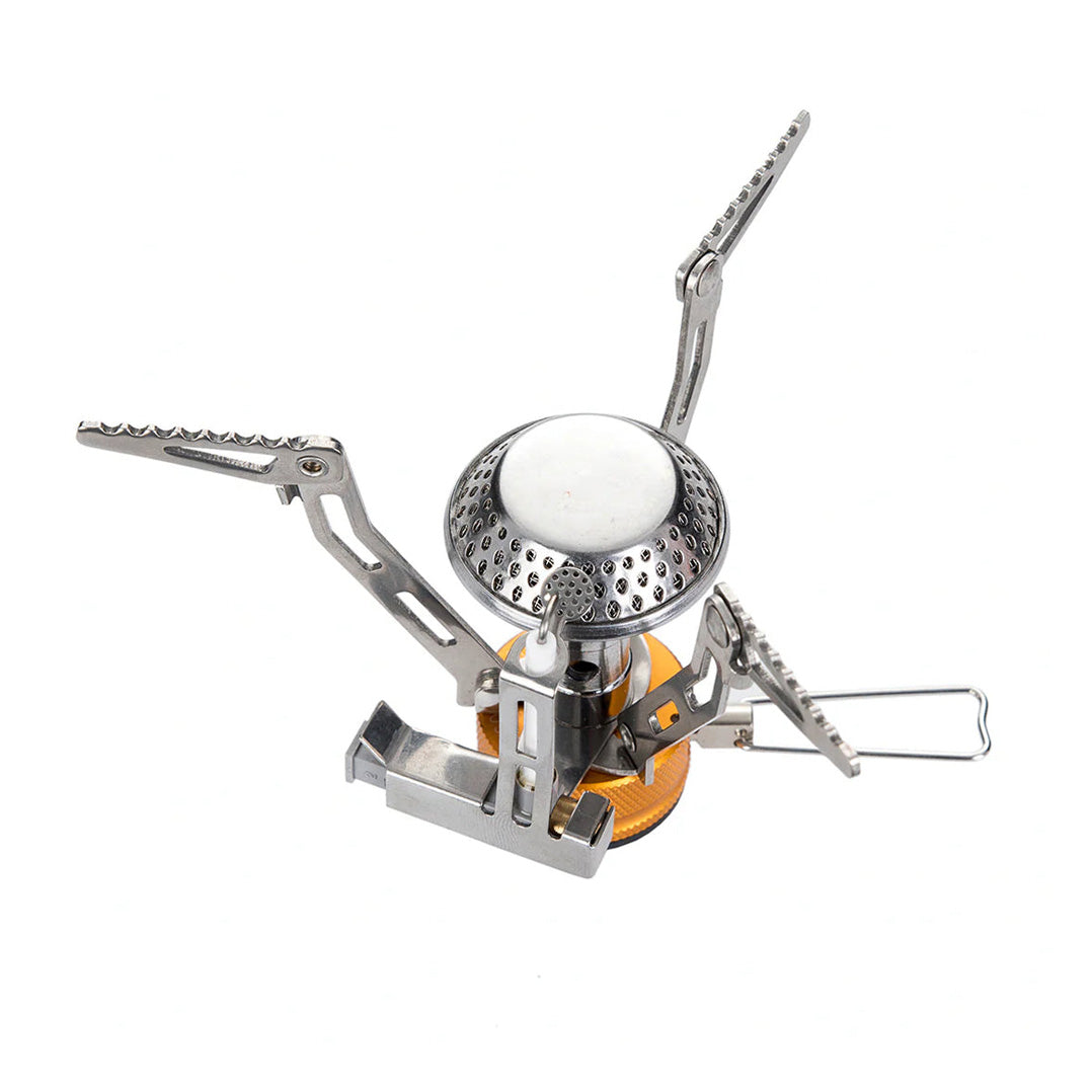 A compact and portable Fire Maple FMS-102 camping stove with an integrated ignition system, featuring silver and gold colors with a foldable design and serrated foot.
