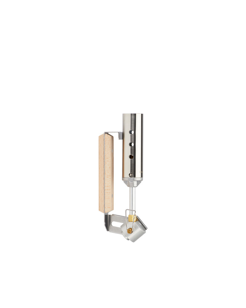 Snow Peak Folding Torch GT-120 folded flat, beech handle collapsed against the stainless burner tube, studio white