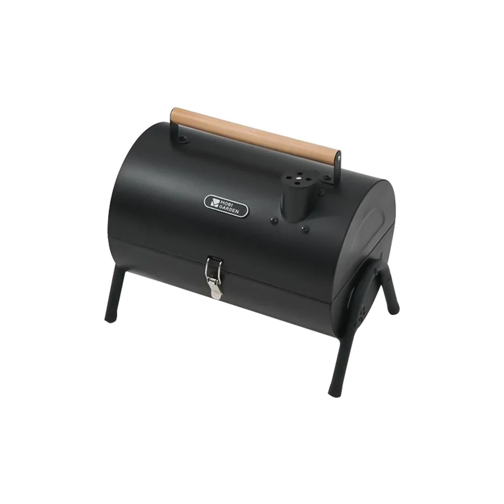 A compact, black two-sided barbecue stove with a wooden handle, designed for outdoor cooking activities like camping and picnics.