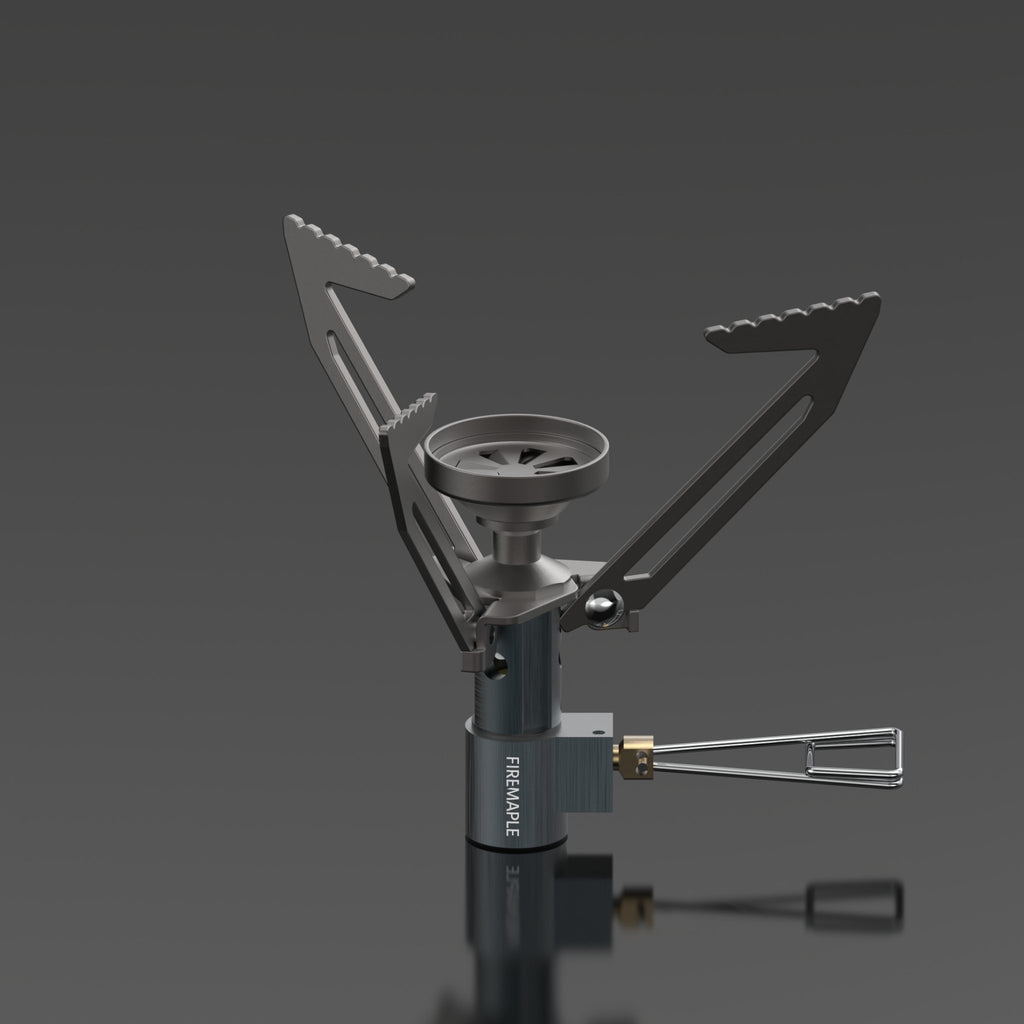 A Fire Maple Hornet Ⅱ Titanium Gas Stove with foldable legs and a small size, displayed against a dark background.