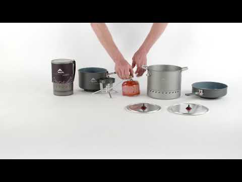 Person setting up camping cookware on a white background