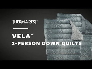Therm-a-Rest Vela 2-person down quilt with text on a dark background