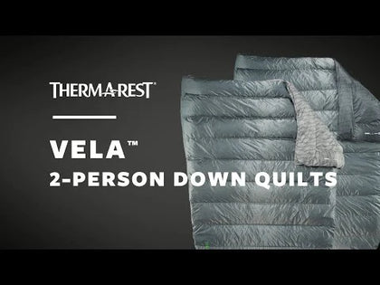 Therm-a-Rest Vela 2-person down quilt with text on a dark background