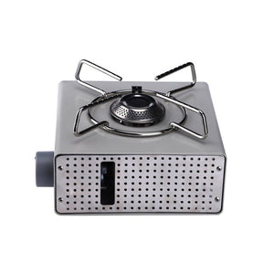 A compact Fire Maple butane gas stove with a stainless steel pot stand and a gold aluminum alloy body.