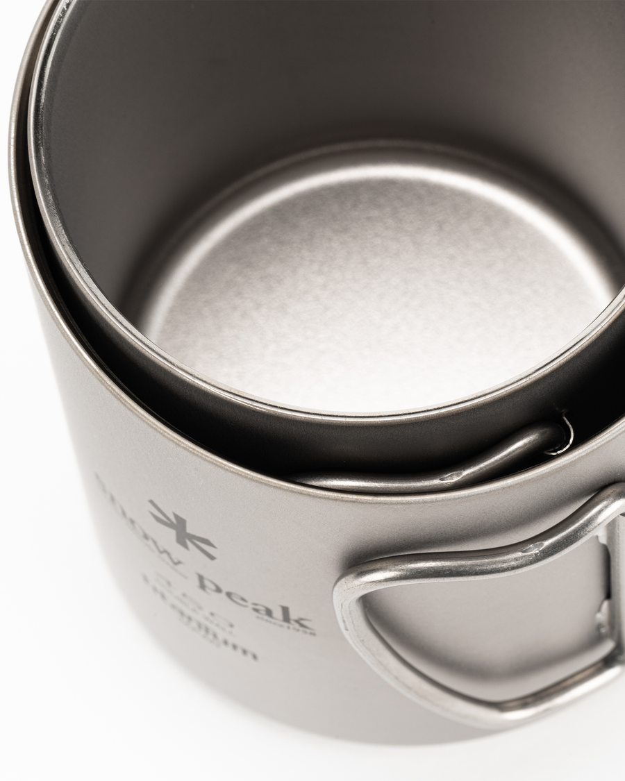 Snow Peak Ti-Double 450 Mug MG-153 in titanium with folding wire handle, studio white background