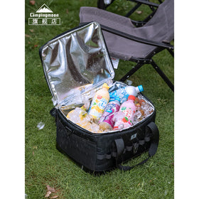 Black insulated cooler bag with drinks on grass, featuring 'Campingmoon' brand.