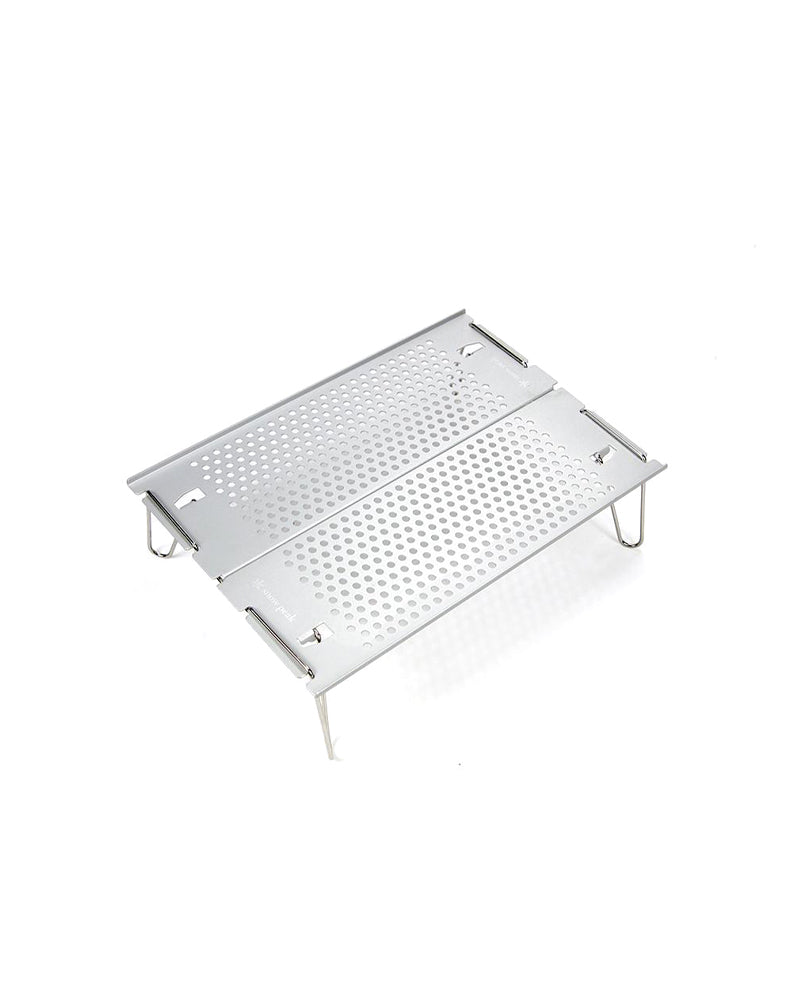 Snow Peak Ozen Solo Table SLV-171 assembled, perforated silver aluminum top on four wire legs, white background